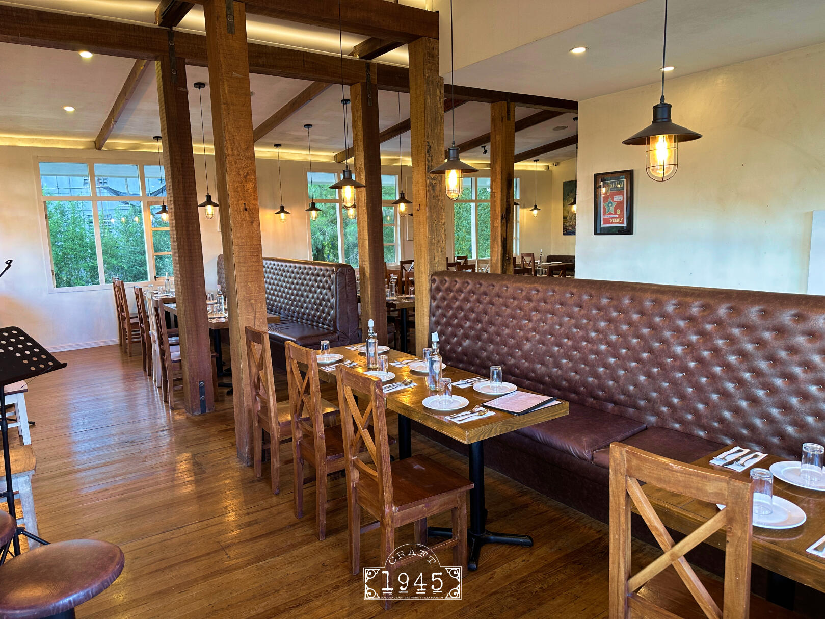 Upstairs dining area Dining area next to windows with a pine tree view